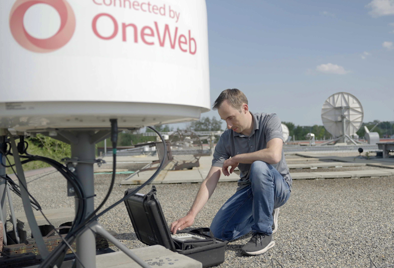 tech-working-on-satellite